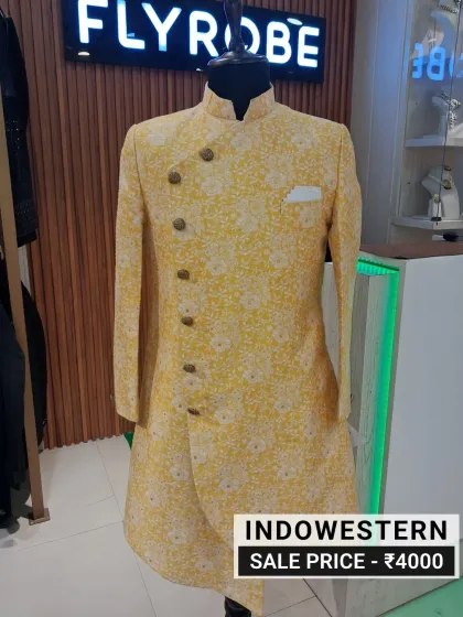 Grooms and guests, we've got you covered. Check out this stunning yellow printed Indo-western sherwani, a perfect statement piece for any wedding. Own this unique designer look for just ₹4000 and turn heads without breaking the bank.