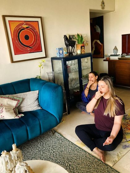 A pranayama (breathwork) practice is a must in every session. I'm guiding my student Kyra through Nadi Shodhana (alternate nostril breathing) to calm her mind and balance her energy.