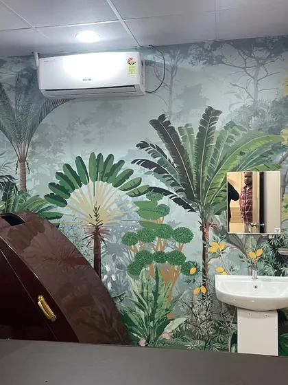 This tropical jungle mural was installed in a spa, creating a relaxing and exotic atmosphere for clients. The lush greenery helps to build a tranquil and rejuvenating environment.