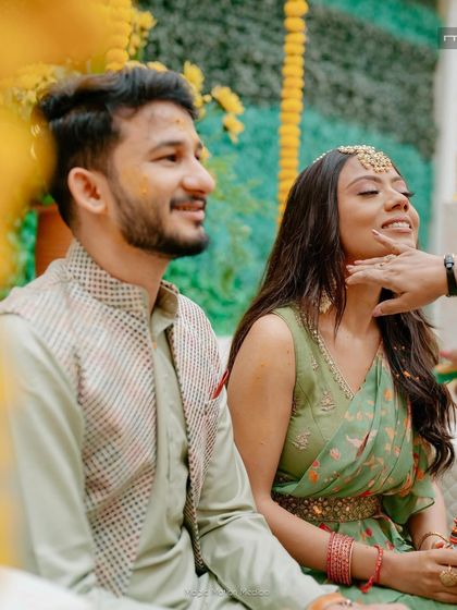 The Haldi ritual. The makeup is minimal and water-resistant, designed to withstand the traditions of the ceremony while still looking beautiful.