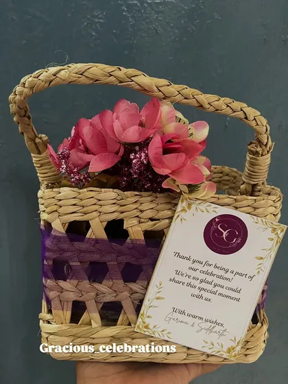 A small and cute wedding favor, this mini woven basket is perfect for holding a small gift or sweets. It comes with a personalized thank you card from the couple.