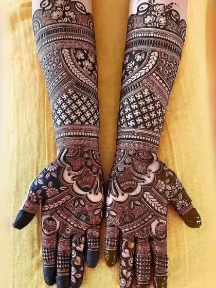 For a bold and traditional look, I use high-contrast patterns like these. This full-arm design combines classic floral work with geometric swastika patterns, creating a powerful and culturally rich statement.