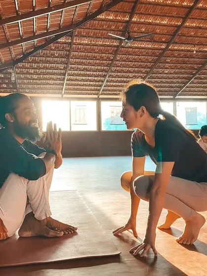This is a duplicate of image 2. The warm light and genuine smiles capture the essence of the teacher-student connection that we foster here.