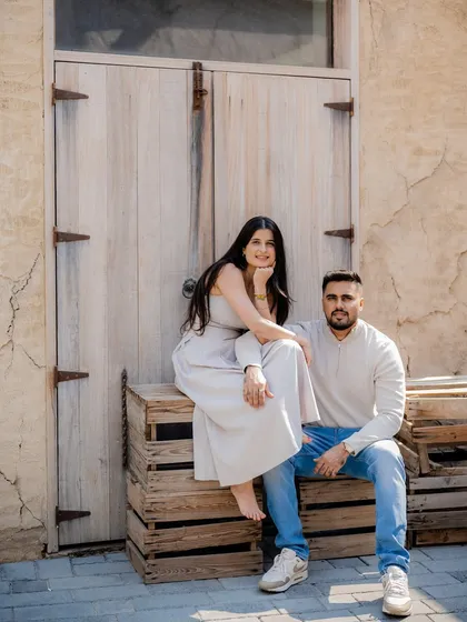 A relaxed and stylish pre-wedding portrait. Using rustic textures like these wooden crates and doors adds character to the photos. It’s about finding beauty in unexpected places and making it part of your story.