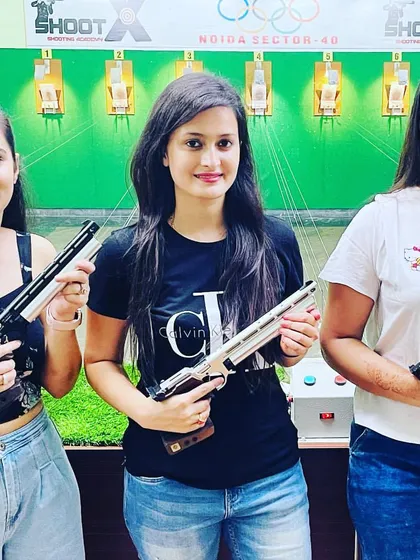A group of friends posing with their air pistols at our Noida range. We welcome everyone to experience the thrill of precision shooting in a supportive environment.