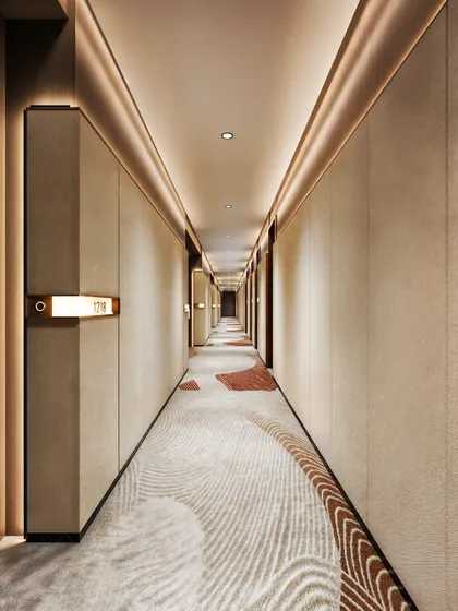 A hotel corridor visualization, where the patterned carpet and linear wall lighting guide the guest's journey.