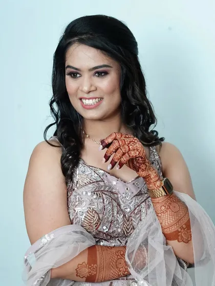 My pretty engagement bride, looking radiant and happy. Her mehndi adds a touch of traditional elegance to her modern engagement look.