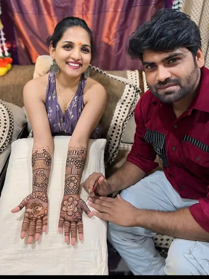 Posing with another satisfied client. Her smile and beautifully adorned hands are a testament to the quality of our work.