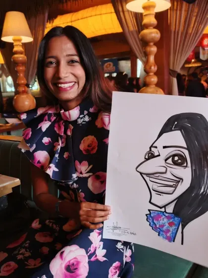 This guest's stylish floral dress was a lovely detail to hint at in her caricature. I had a blast sketching at this event.