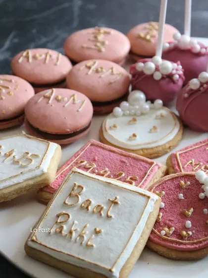 A detailed shot of the personalized cookies and macarons. I can add your initials, date, or special messages in beautiful gold lettering.