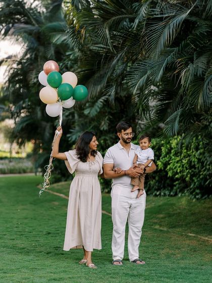 A family enjoying an outdoor birthday celebration with balloons. The movement and happiness in this shot are what I strive for.