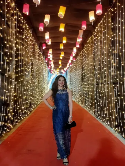 For a more formal event, I designed this elegant navy blue lace jumpsuit. It's a contemporary piece that is custom-fit to ensure a flattering silhouette for any special occasion.