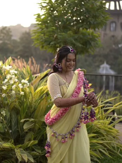 A candid shot of the bride, happy and glowing in her custom floral jewellery. We love creating pieces that become a part of such joyful memories.