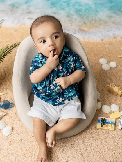 A thoughtful moment by the 'sea'. These creative setups are designed to be safe and engaging for even the youngest babies.