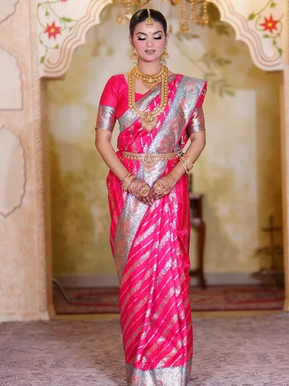 My signature bridal look on a beautiful South Indian bride. The pink Kanjeevaram saree and gold temple jewellery are iconic, and the makeup is designed to match that grandeur.