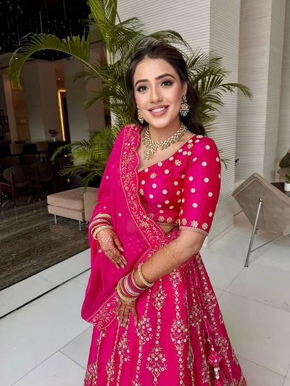 A vision in rani pink for her Godh Tikka ceremony. I created a soft smokey eye and a glowing base to complement her heirloom lehenga.