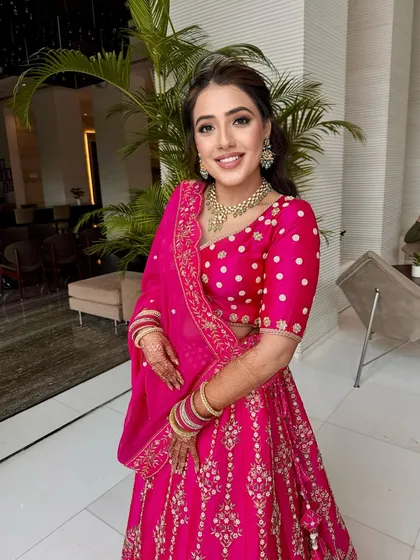A vision in rani pink for her Godh Tikka ceremony. I created a soft smokey eye and a glowing base to complement her heirloom lehenga.