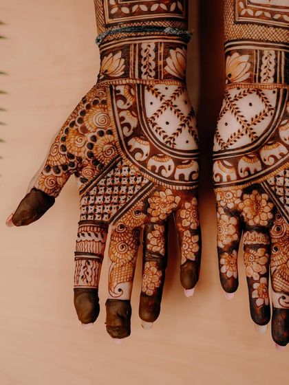 A close-up shot against a light wood background, highlighting the clean lines and beautiful floral and elephant motifs.