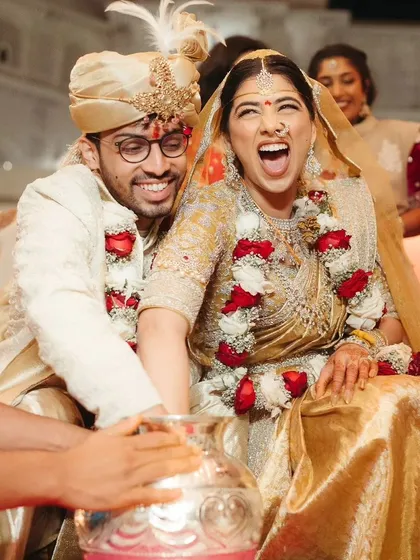 Even during traditional rituals, we find moments of fun and laughter. Capturing the couple's genuine happiness during the wedding games is a reminder that a wedding should be a festival of memories.