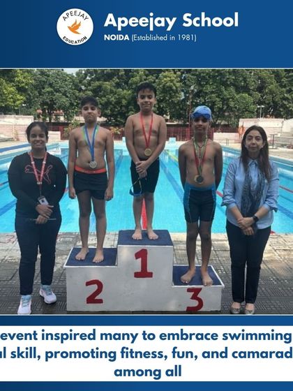 Winners of another boys' swimming event are celebrated on the podium. The competition inspired many to embrace swimming as a vital skill, promoting fitness, fun, and camaraderie among all participants.