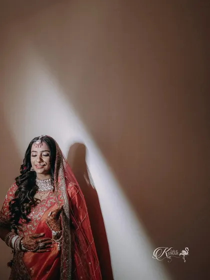 A bridal portrait using a single light source to create a dramatic shadow and highlight her form.