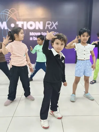 Our little dancers striking a pose! The kids' classes are designed to be fun and help them express their creativity.