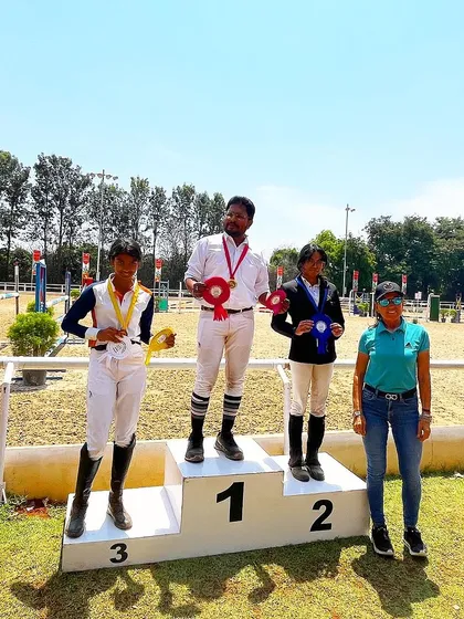 A classic podium shot from EIRS. Our riders consistently perform at a high level, securing top spots in show jumping and dressage events.