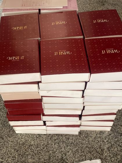 Stacks of our signature red Wishit boxes, waiting to be filled with Diwali goodies. This is what gratitude and a little bit of chaos looks like.