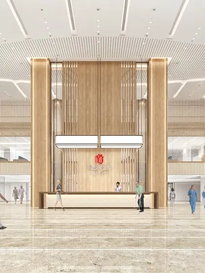 This rendering of the Yashoda Medicity lobby emphasizes its grand scale and symmetrical design. The space is planned to manage large volumes of people while maintaining a sense of order and calm.