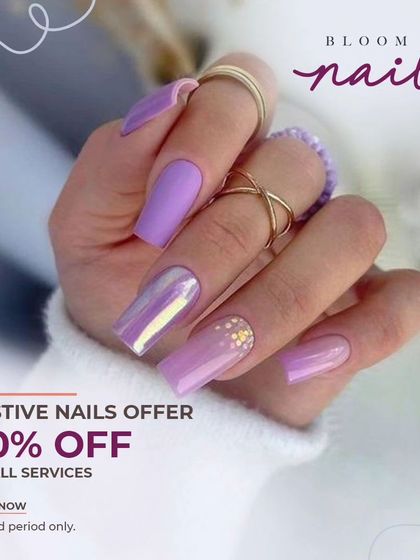 A gorgeous set of lilac nails on long, square extensions. The design includes a chrome accent nail and delicate gold details.