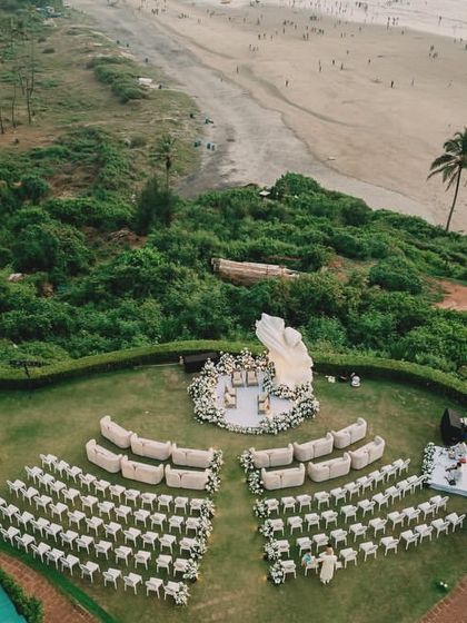 An aerial shot of our Picasso-inspired mandap for an ivory sundowner wedding. The design was intentionally minimalist yet sculptural to honor the stunning natural backdrop of the sea and sand.