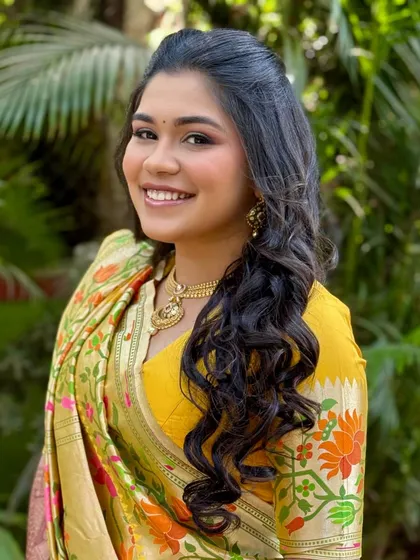 A happy, smiling portrait of the bride. Her makeup is fresh and light, allowing her natural joy to be the focus.