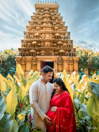 A beautiful maternity photo in front of our grand temple gopuram replica, blending spirituality and new beginnings.