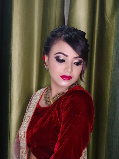 A close-up of the eye makeup, featuring a shimmery lid and defined crease.