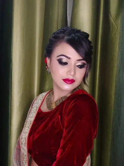 A close-up of the eye makeup, featuring a shimmery lid and defined crease.