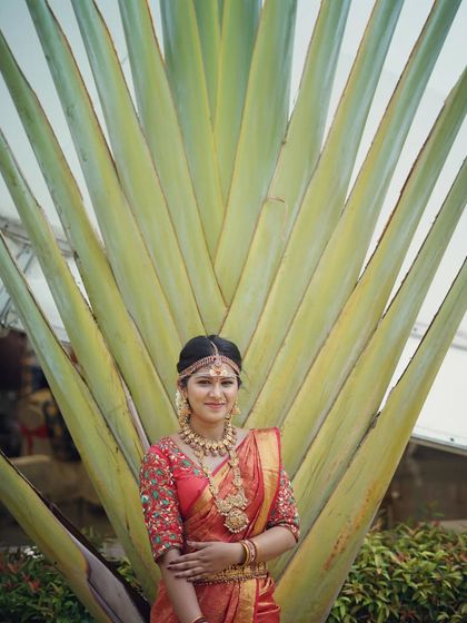 A beautiful portrait of a model wearing our traditional bridal set. The intricate details of the jewellery are designed to be photogenic and impressive.