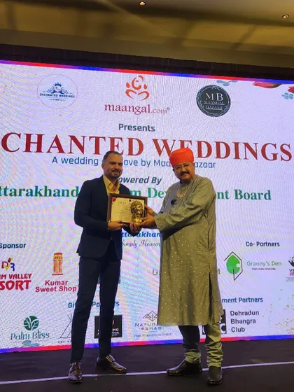 Receiving an award at the 'Enchanted Weddings' conclave. It's an honor to be recognized for my contribution to the industry.