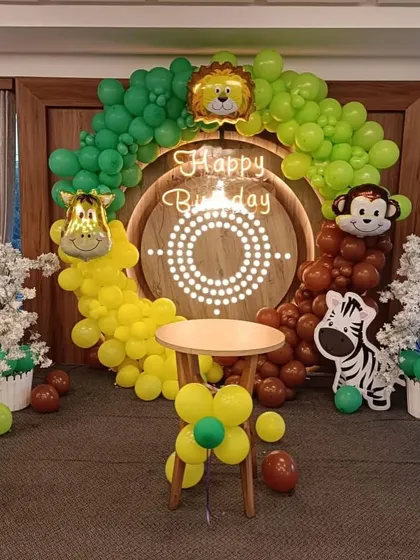 A close-up of the jungle theme backdrop, highlighting the neon sign and central wooden panel.
