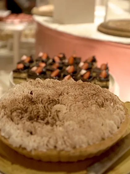 A classic tiramisu pie with a cocoa-dusted top, a comforting and sophisticated dessert choice.