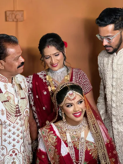 A lovely family portrait, capturing the joy of the wedding day.
