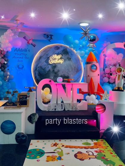 The space theme with a star filter effect, emphasizing the magical, twinkling galaxy we created for this first birthday.