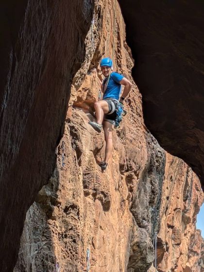 Anand looking happy and confident in a cave route in Badami. The diverse geology of the places we climb offers endless challenges and experiences.