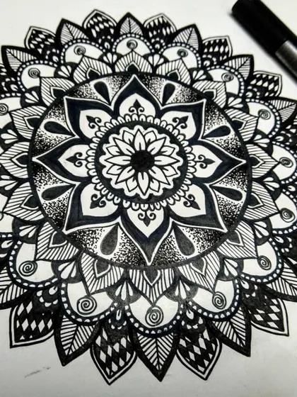 This black and white floral mandala is a perfect example of the designs we learn to create in my workshops. It's all about building layers of petals and patterns, and I'll guide you through every step, no matter your skill level.