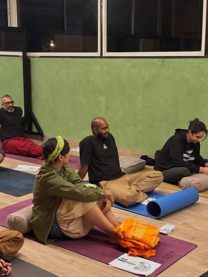 Engaged and present. Members of our community listen and interact during a workshop, creating a collective energy of learning and shared experience.