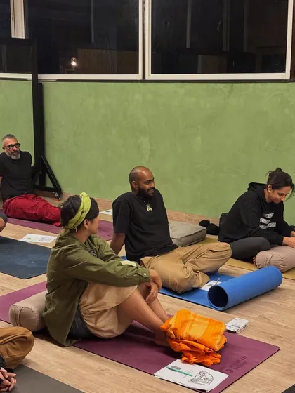 Engaged and present. Members of our community listen and interact during a workshop, creating a collective energy of learning and shared experience.