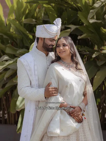 A picture of pure elegance. For this couple, I created a coordinated look with a focus on flawless skin for the bride and a clean, natural finish for the groom, perfect for their daytime wedding ceremony.