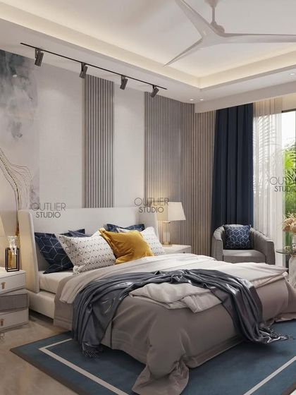 Your personal masterpiece. This bedroom uses a cool color palette of blue, grey, and yellow, with an abstract art piece above the bed and track lighting to create a modern and artistic vibe.
