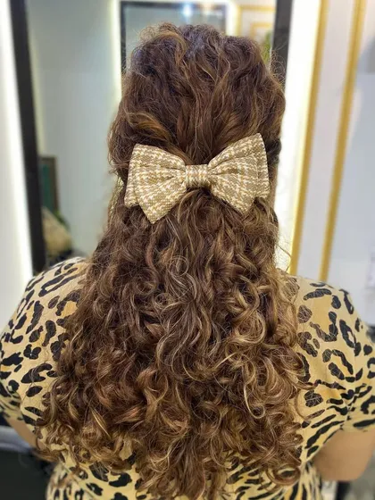I am a forever lover of cute hair accessories. A simple bow can add a touch of personality and style to a half-updo.