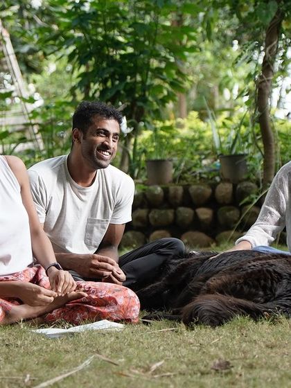 A relaxed moment at a Flow Fest. Our retreats are not just about training; they're about connecting, laughing, and enjoying time together in nature.