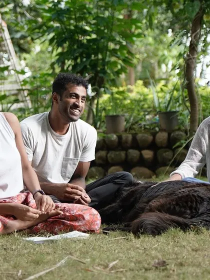 A relaxed moment at a Flow Fest. Our retreats are not just about training; they're about connecting, laughing, and enjoying time together in nature.